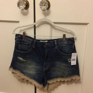 free people distressed denim shorts with lace